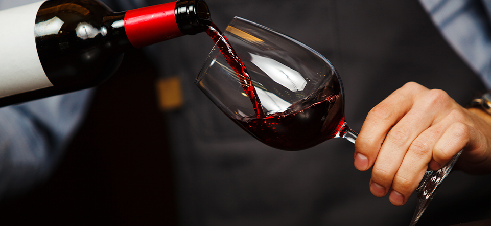 Red wine being poured into a glass